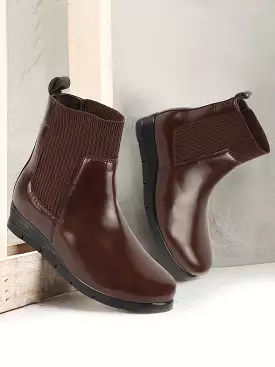 Brown women's slip-on wedge heel Chelsea boots with mid top socks collar, designed for broad feet.