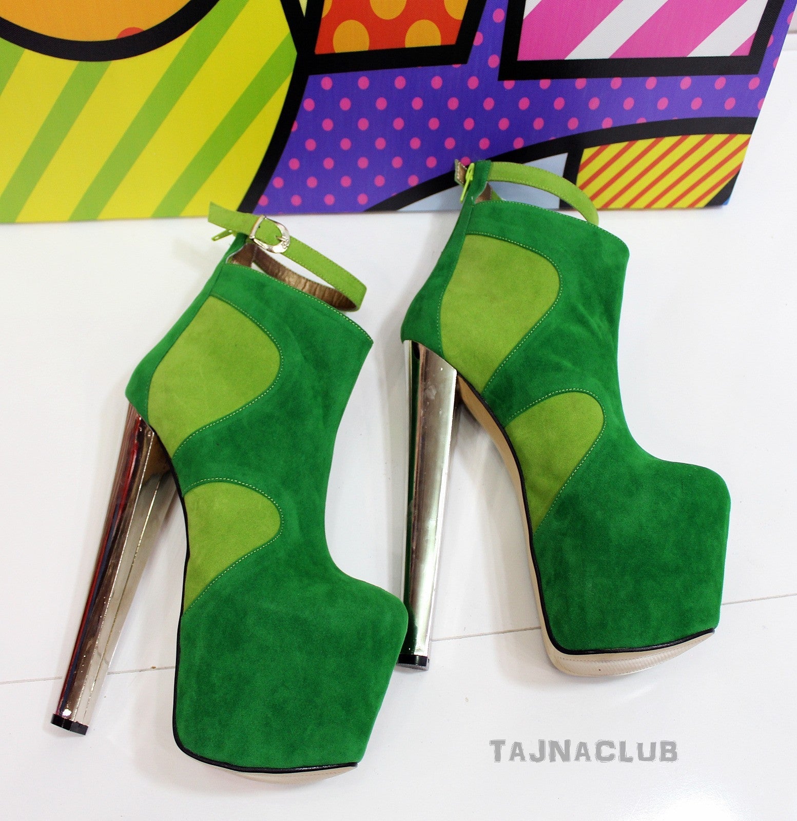 Green suede platform ankle boots with high heels.