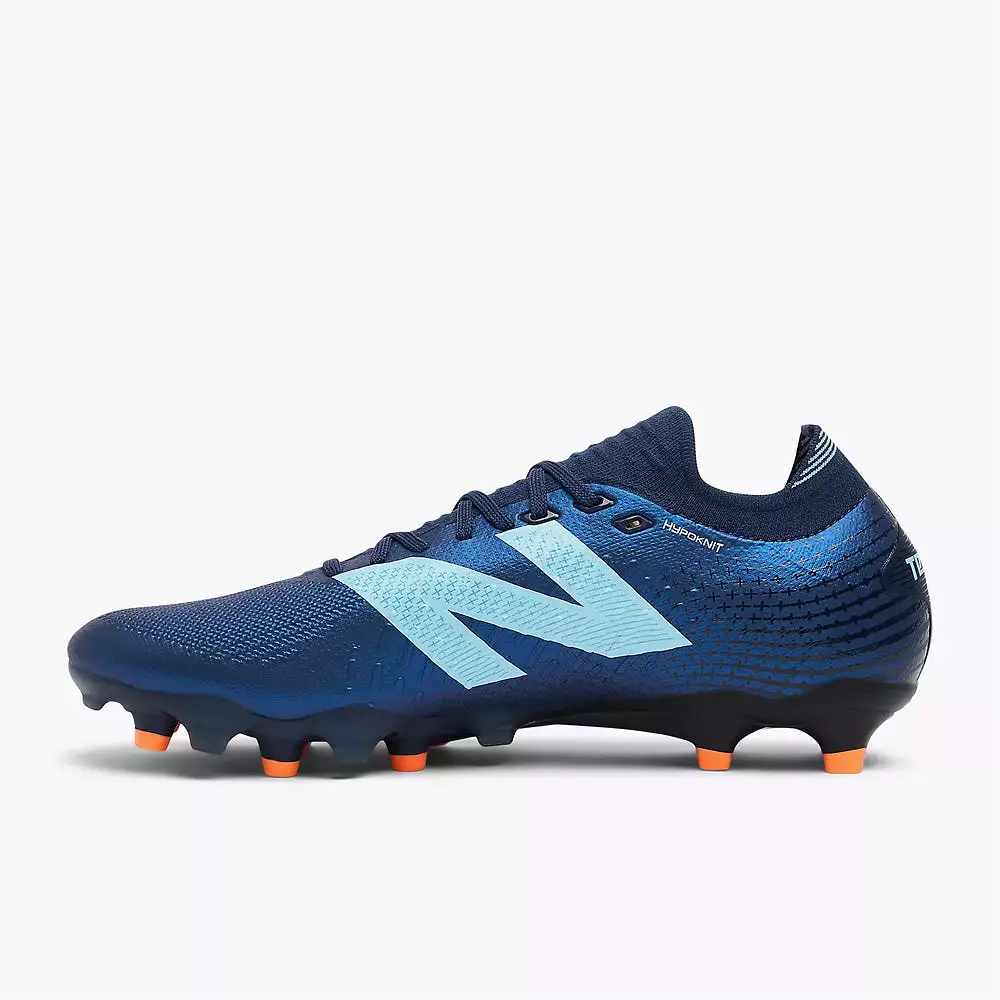 New Balance Tekela Pro Low V4+ FG Football Boots, Navy/Sky Blue/Hot Mango.