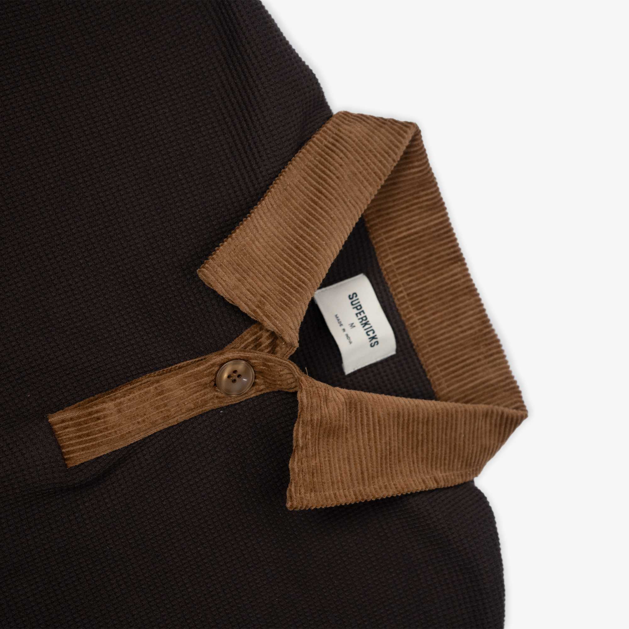 Polo shirt in brown with corduroy details - result 1: Waffle knit polo with corduroy accents in brown.