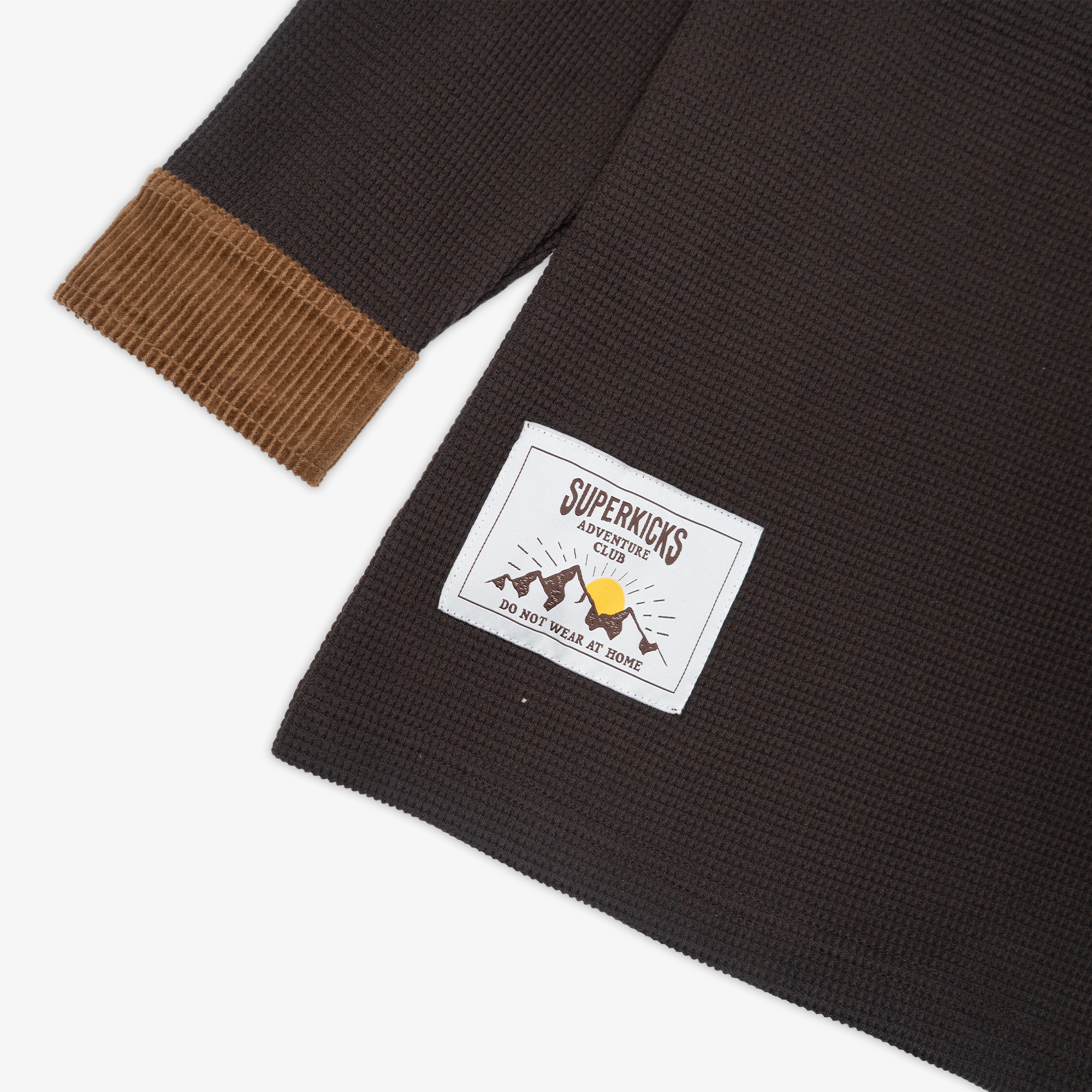 Polo shirt in brown with corduroy details - result 1: Waffle knit polo with corduroy accents in brown.